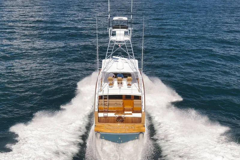 Slide: The Image of 1995 Merritt 65 Sport Fish yacht cruising on open water, rear view. - 5