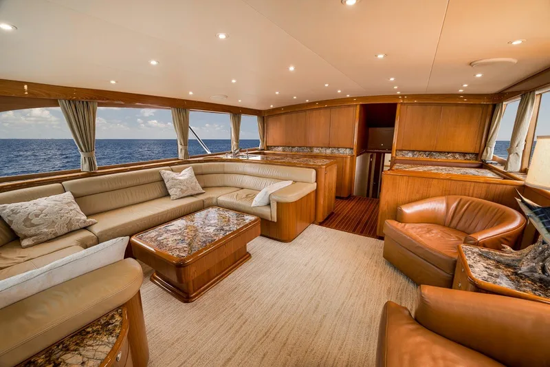 Slide: The Image of Luxurious interior of 1995 Merritt 65 Sport Fish yacht with elegant seating and ocean view. - 37