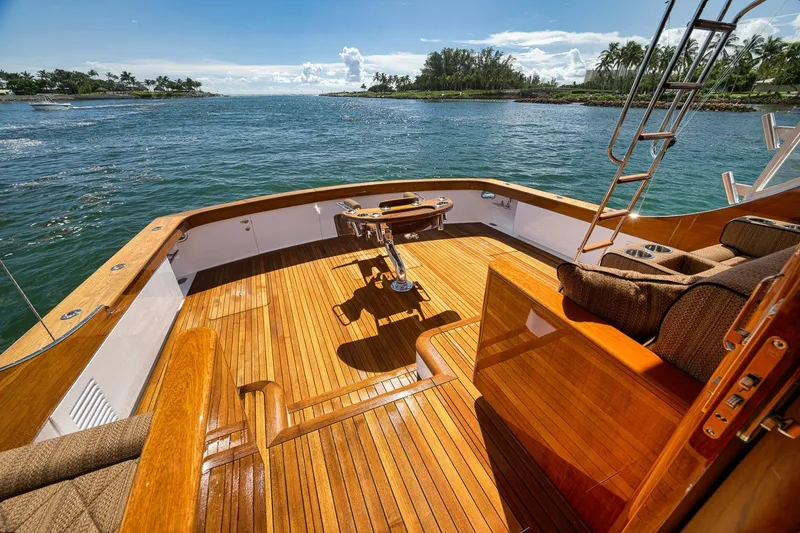 Slide: The Image of Luxurious 1995 Merritt 65 Sport Fish yacht with polished wooden deck and ocean view. - 20
