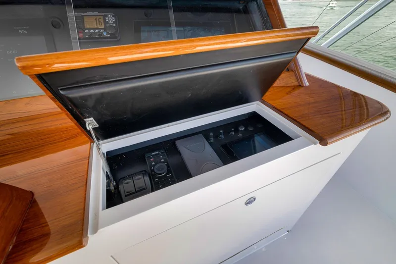 Slide: The Image of Control panel of a 1995 Merritt 65 Sport Fish boat with wooden accents. - 9
