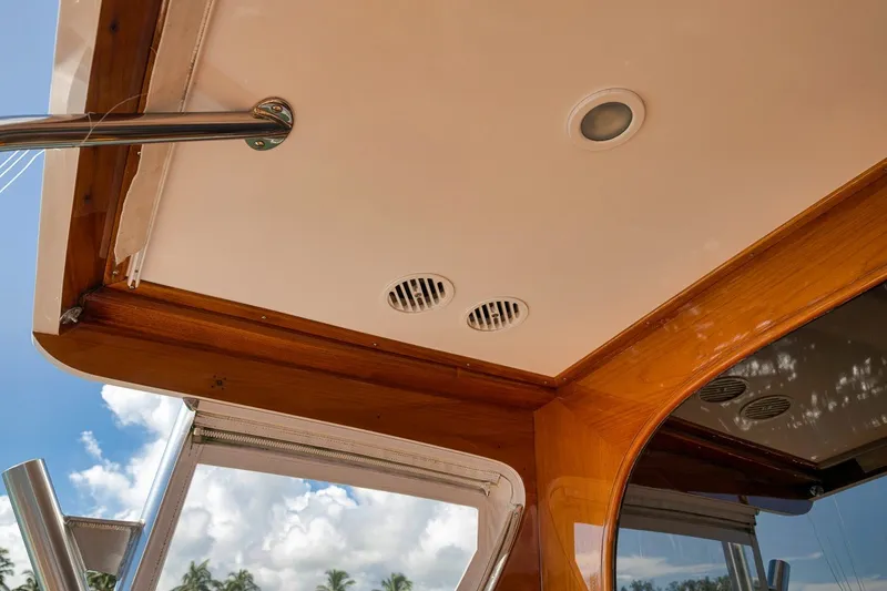 Slide: The Image of Ceiling view of 1995 Merritt 65 Sport Fish boat with wooden trim and vents. - 17