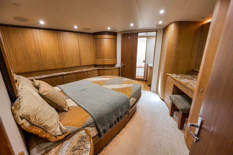Slide: The Image of Luxurious cabin interior of 1995 Merritt 65 Sport Fish yacht with wood paneling. - 48