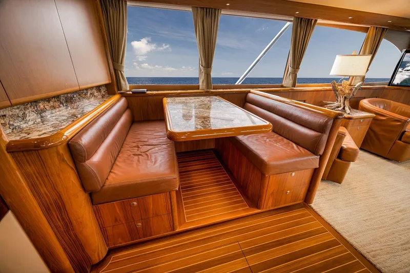 Slide: The Image of Luxurious interior of 1995 Merritt 65 Sport Fish yacht with leather seating and ocean view. - 45