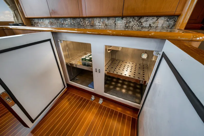 Slide: The Image of Interior view of a 1995 Merritt 65 Sport Fish yacht's storage compartment. - 43