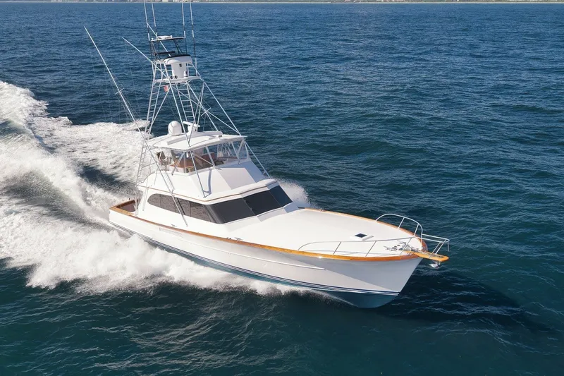 Slide: The Image of 1995 Merritt 65 Sport Fish yacht cruising on open ocean waters. - 56