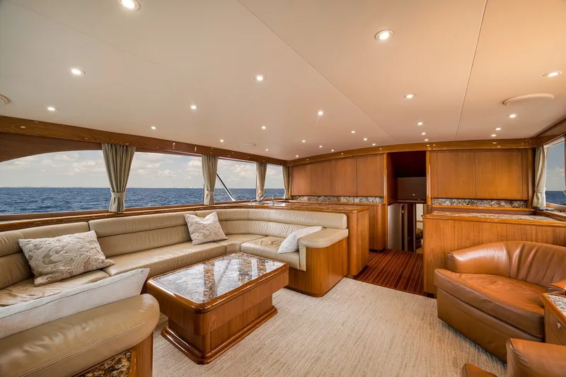 Slide: The Image of Luxurious interior of 1995 Merritt 65 Sport Fish yacht with elegant seating and ocean view. - 36