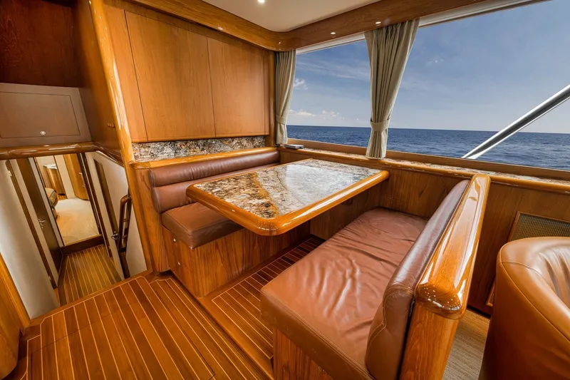 Slide: The Image of Luxurious interior of 1995 Merritt 65 Sport Fish yacht with ocean view. - 44