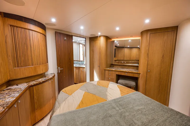 Slide: The Image of Luxurious cabin interior of 1995 Merritt 65 Sport Fish yacht with wood finishes. - 49
