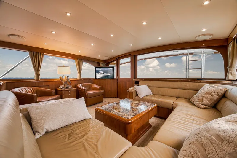 Slide: The Image of Luxurious interior of 1995 Merritt 65 Sport Fish yacht with plush seating and elegant decor. - 38