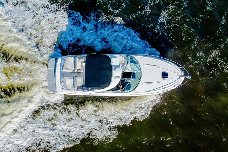 Slide: The Image of Overhead view of 2013 Sea Ray 370 Venture yacht cruising through water. - 14