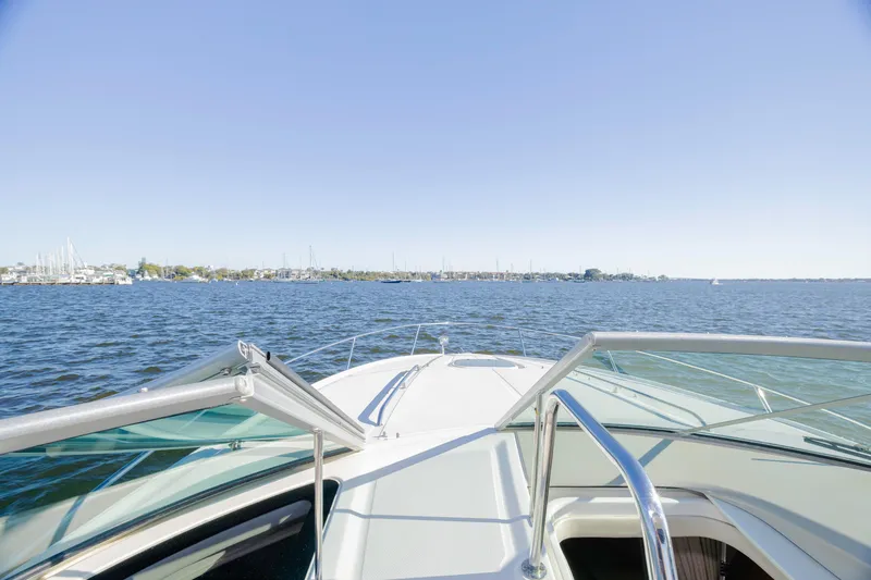 Slide: The Image of 2013 Sea Ray 370 Venture cruising on a sunny day with clear blue skies. - 26