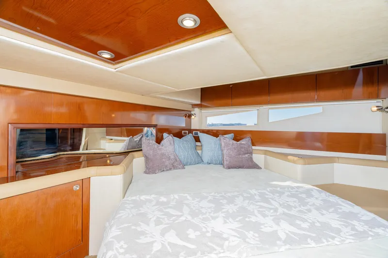 Slide: The Image of Luxurious interior of 2013 Sea Ray 370 Venture yacht with elegant bedding and wood finishes. - 35