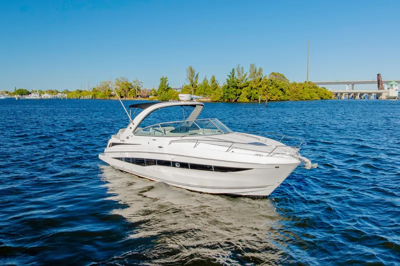 Slide: The Image of 2013 Sea Ray 370 Venture cruising on a sunny day in a scenic waterway. - 12