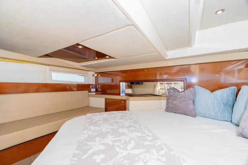 Slide: The Image of Luxurious interior of 2013 Sea Ray 370 Venture yacht with elegant seating and bedding. - 21