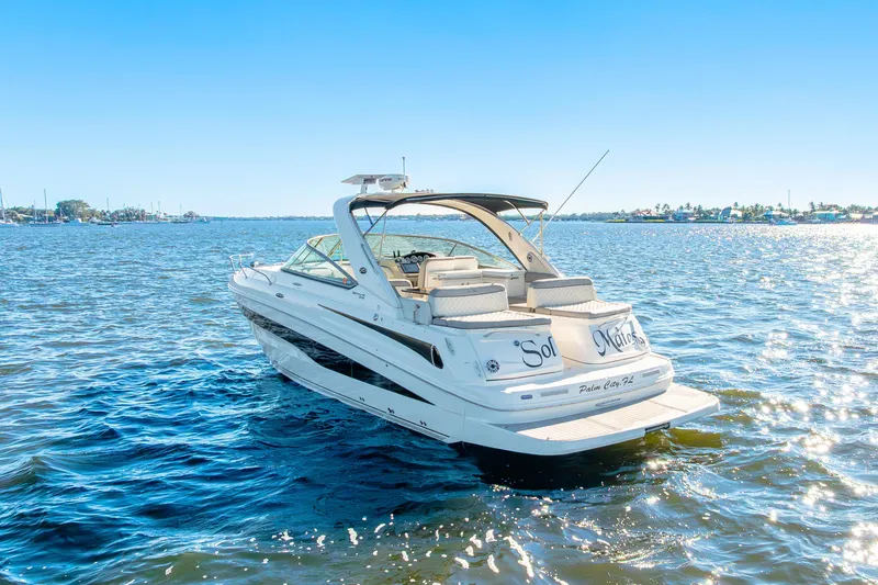 Slide: The Image of 2013 Sea Ray 370 Venture boat on sunny, calm waters. - 13