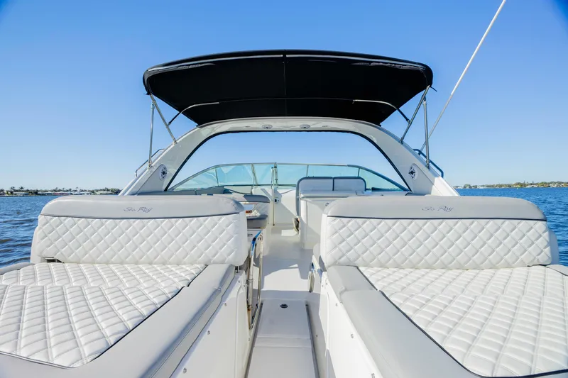 Slide: The Image of 2013 Sea Ray 370 Venture boat with luxurious seating on a sunny day. - 8
