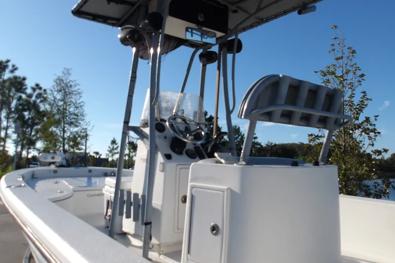 Slide: The Image of 2008 Ranger 2200 Bay Ranger boat with console and seating, outdoors on a sunny day. - 4