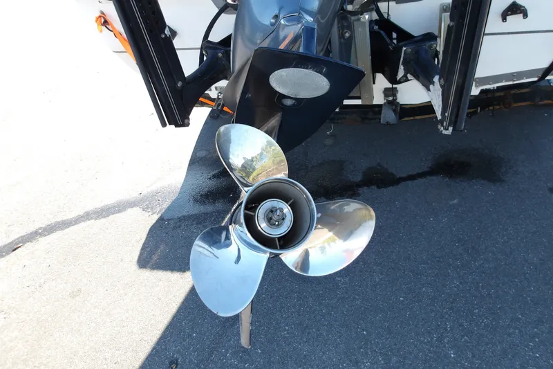 Slide: The Image of 2008 Ranger 2200 Bay Ranger boat propeller on asphalt surface. - 12