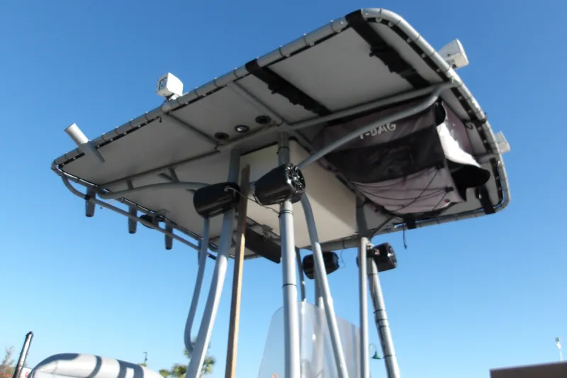 Slide: The Image of T-top of 2008 Ranger 2200 Bay Ranger boat against clear blue sky. - 15