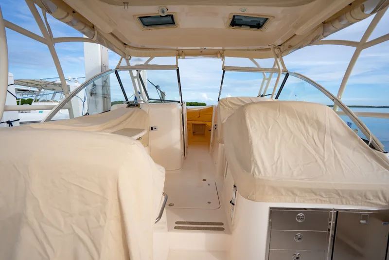Slide: The Image of 2015 Grady-White Freedom 335 boat interior with covered seating and open cockpit. - 20