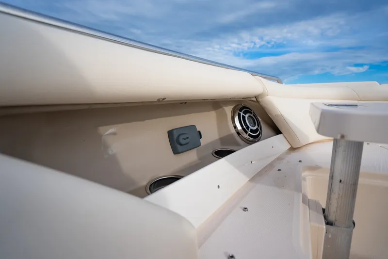 Slide: The Image of 2015 Grady-White Freedom 335 boat interior with speaker and cup holders. - 27