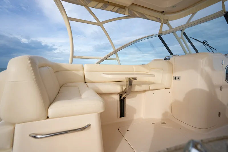 Slide: The Image of 2015 Grady-White Freedom 335 boat interior with cream seating and ocean view. - 33