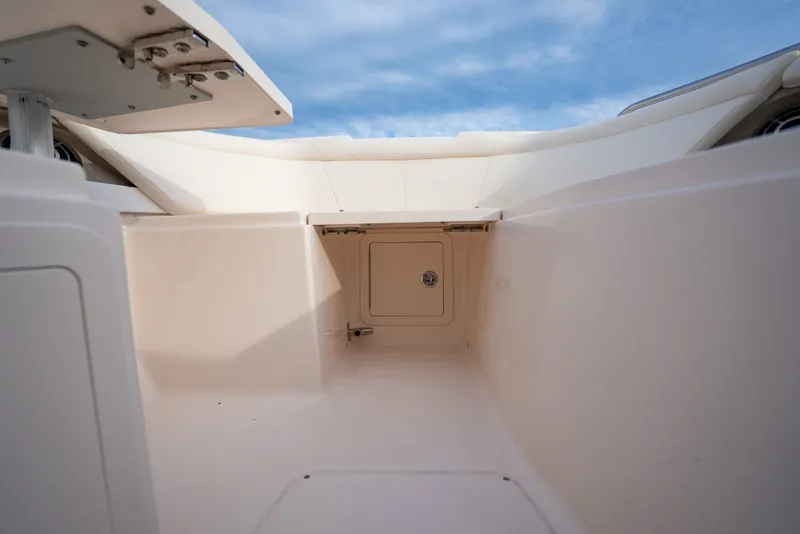 Slide: The Image of Interior view of 2015 Grady-White Freedom 335 boat storage compartment under blue sky. - 29