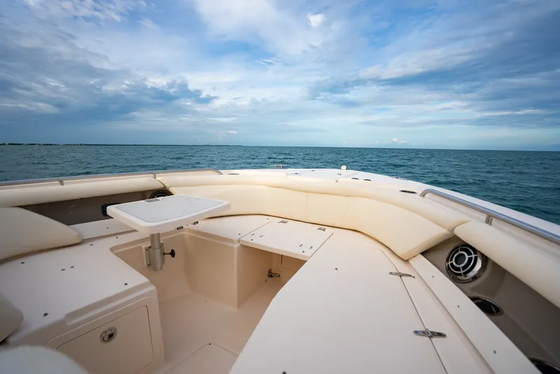 Slide: The Image of 2015 Grady-White Freedom 335 boat interior with ocean view and seating area. - 24