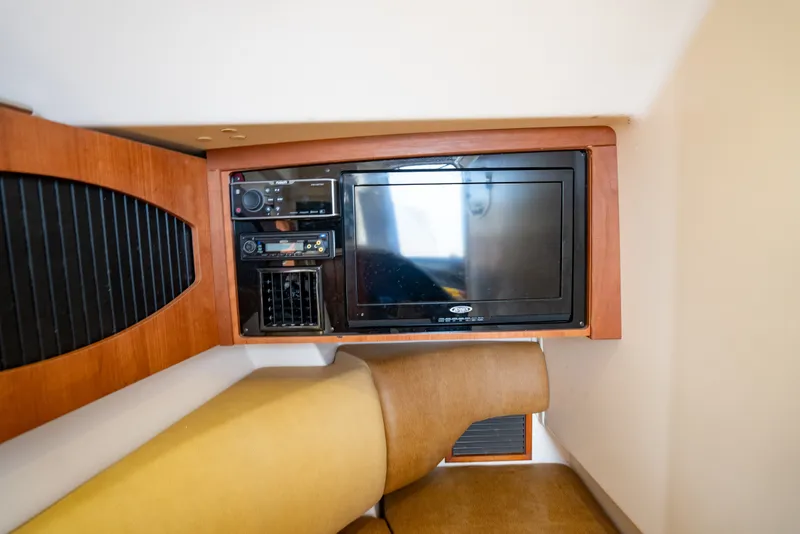 Slide: The Image of Interior of 2015 Grady-White Freedom 335 boat with TV and audio system. - 54