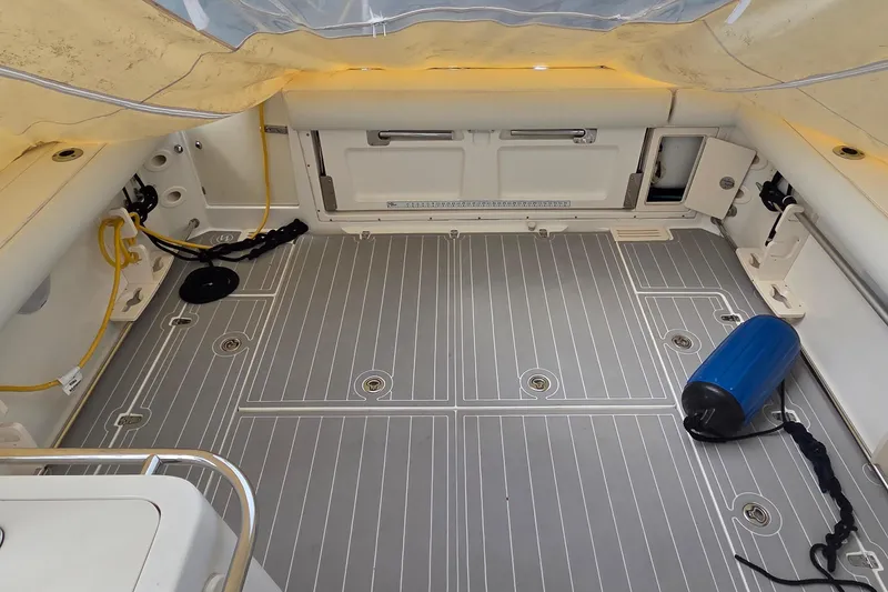 Slide: The Image of 2007 Boston Whaler 305 Conquest boat deck with clean, spacious layout and equipment. - 49