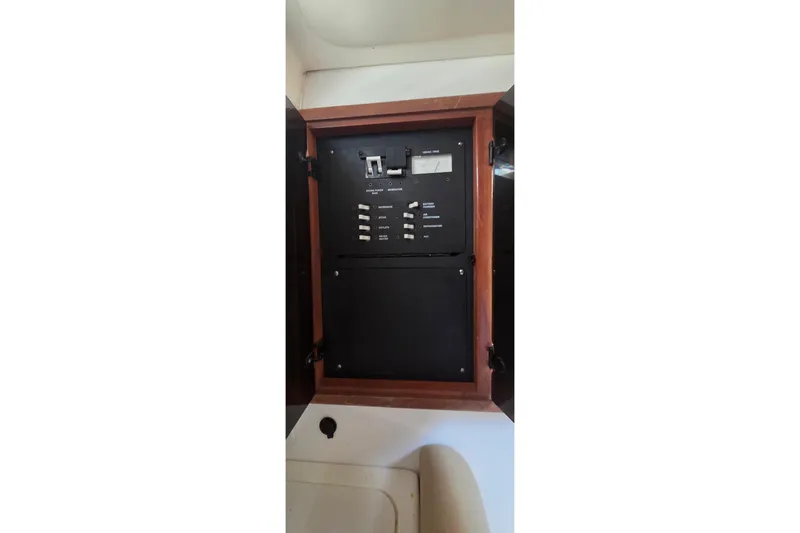 Slide: The Image of Electrical panel inside a 2007 Boston Whaler 305 Conquest boat cabin. - 41