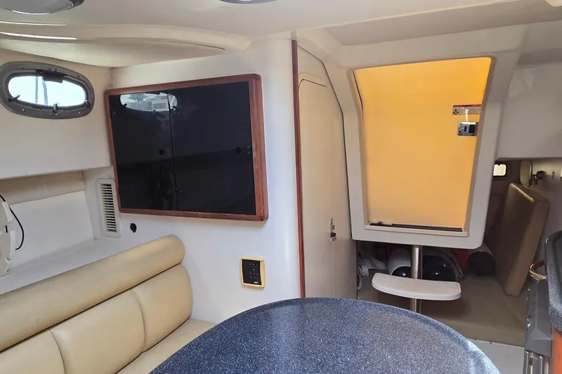 Slide: The Image of Interior of 2007 Boston Whaler 305 Conquest, featuring seating and storage compartments. - 42