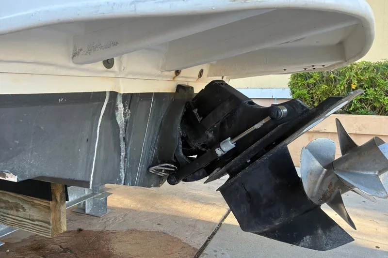 Slide: The Image of 2014 Sea Ray 240 Sundeck boat propeller and stern drive detail. - 11