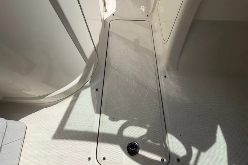 Slide: The Image of 2014 Sea Ray 240 Sundeck interior floor detail with storage compartment. - 41