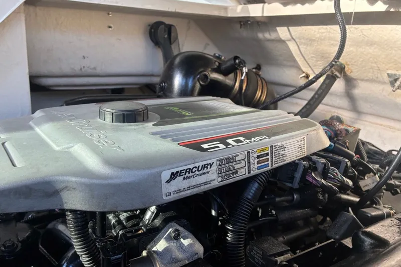 Slide: The Image of Engine compartment of a 2014 Sea Ray 240 Sundeck with 5.0 MPI MerCruiser engine. - 55