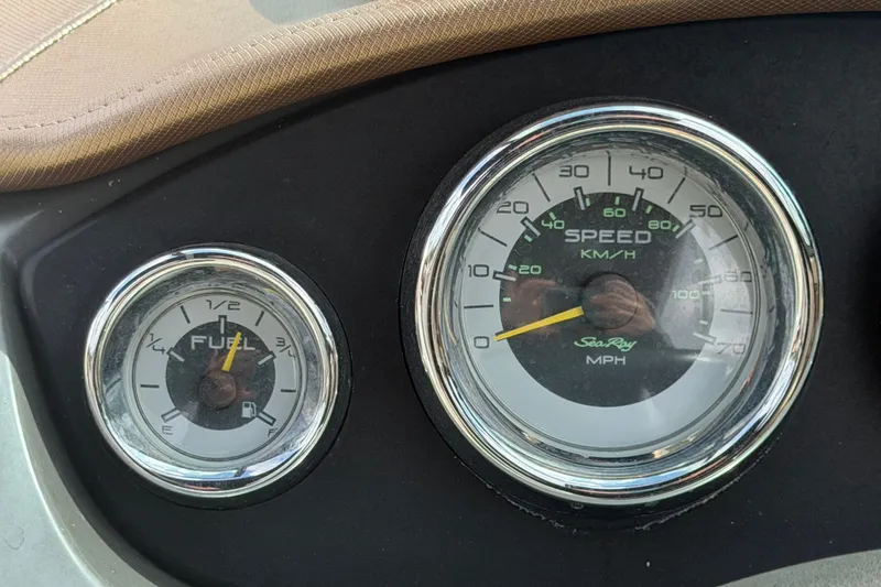 Slide: The Image of Dashboard of 2014 Sea Ray 240 Sundeck showing fuel and speed gauges. - 37