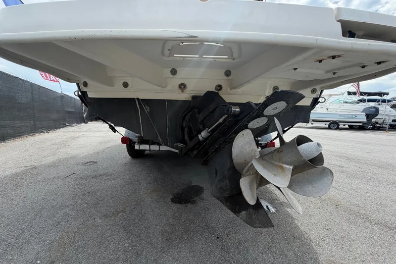 Slide: The Image of 2014 Sea Ray 240 Sundeck boat stern view with propeller and outdrive. - 5
