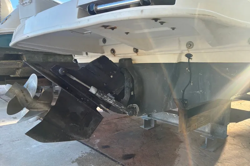 Slide: The Image of 2014 Sea Ray 240 Sundeck boat stern with propeller and outdrive visible. - 12