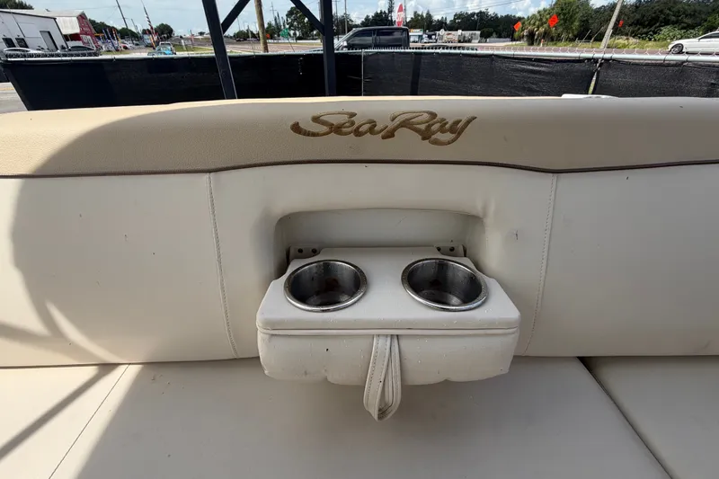 Slide: The Image of 2014 Sea Ray 240 Sundeck boat seat with integrated cup holders. - 78