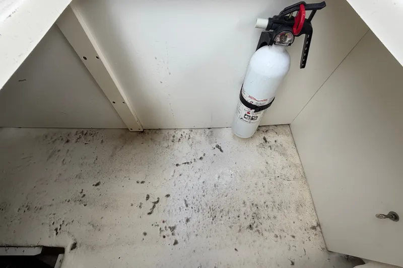Slide: The Image of Interior of 2014 Sea Ray 240 Sundeck with mounted fire extinguisher. - 76