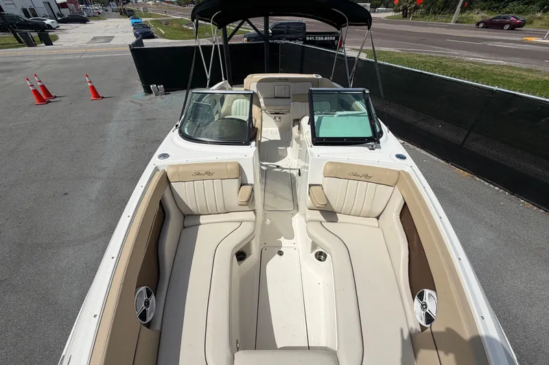 Slide: The Image of 2014 Sea Ray 240 Sundeck boat with spacious seating and sleek design. - 62