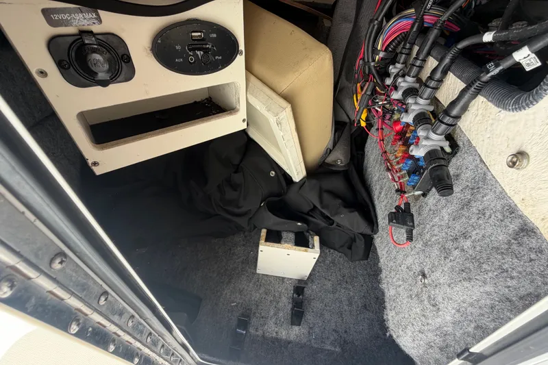 Slide: The Image of Interior view of a 2014 Sea Ray 240 Sundeck showing wiring and control panel. - 47