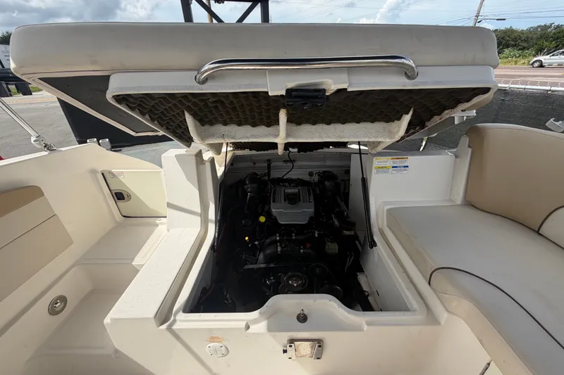 Slide: The Image of Open engine compartment of a 2014 Sea Ray 240 Sundeck boat. - 79