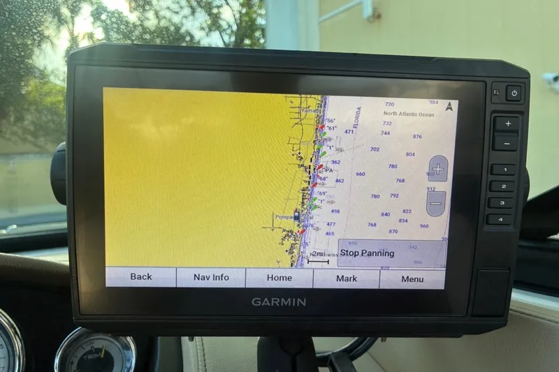 Slide: The Image of Garmin GPS displaying nautical map on 2014 Sea Ray 240 Sundeck boat dashboard. - 44