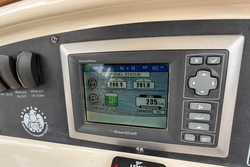 Slide: The Image of Control panel of a 2013 Boston Whaler 32 Justice boat displaying vessel status. - 16