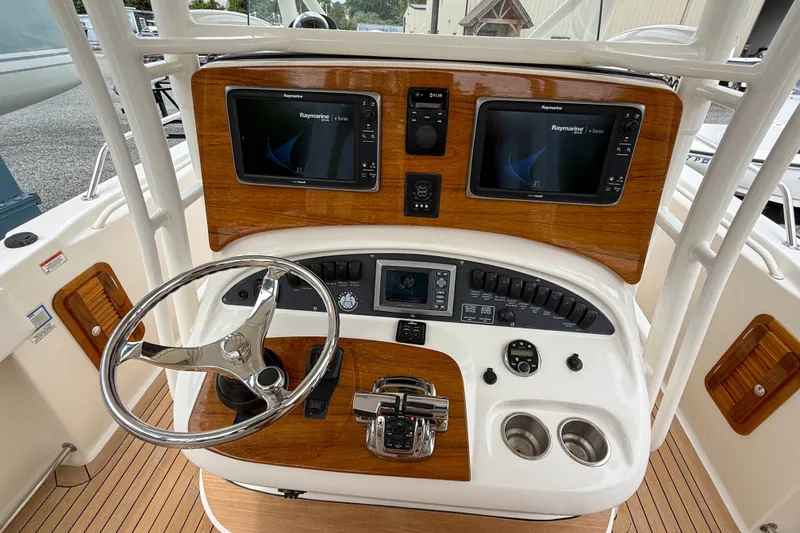 Slide: The Image of Control panel of a 2013 Boston Whaler 32 Justice boat with dual Raymarine displays. - 15