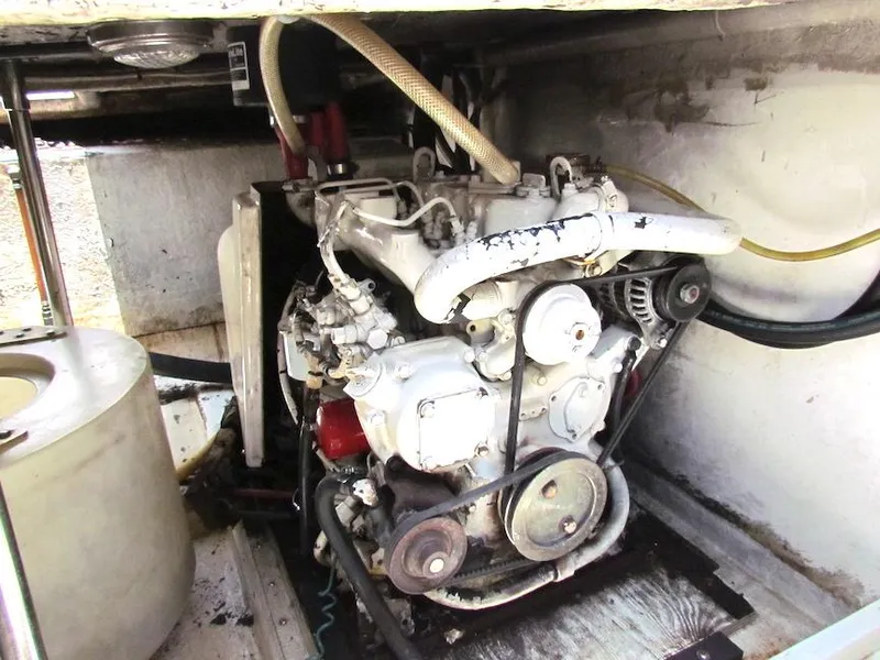 Slide: The Image of Engine compartment of a 1997 Hyatt 55, showcasing mechanical components and belts. - 40