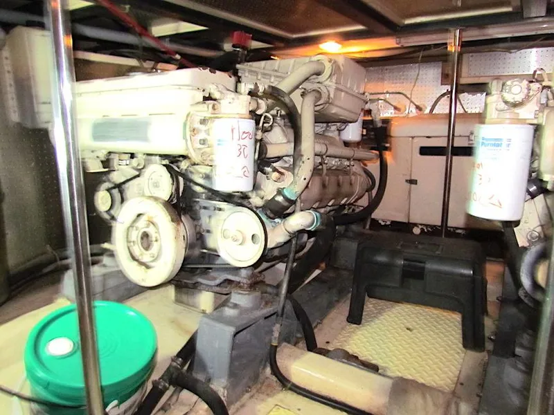 Slide: The Image of Engine room of a 1997 Hyatt 55 yacht, featuring mechanical components and equipment. - 29