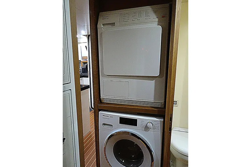 Slide: The Image of Stacked washer and dryer inside 2010 Azimut 100 Leonardo yacht. - 54