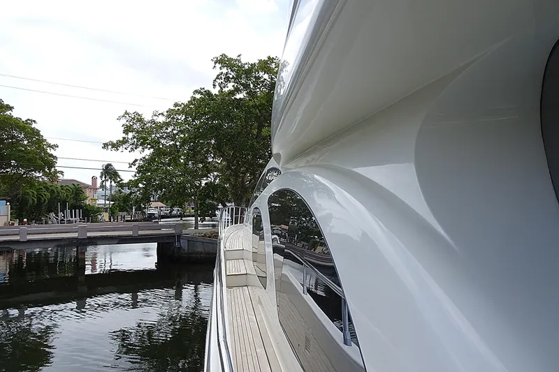 Slide: The Image of Side view of 2010 Azimut 100 Leonardo yacht docked by a canal. - 82